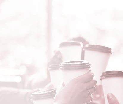 Group cheers with beverage cups